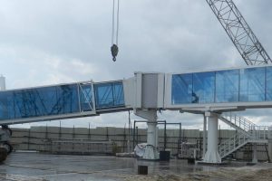 Boarding bridge: One of the boarding bridges that are being installed at Cheddi Jagan International Airport as a part of the airport expansion project. (CJIA photo)