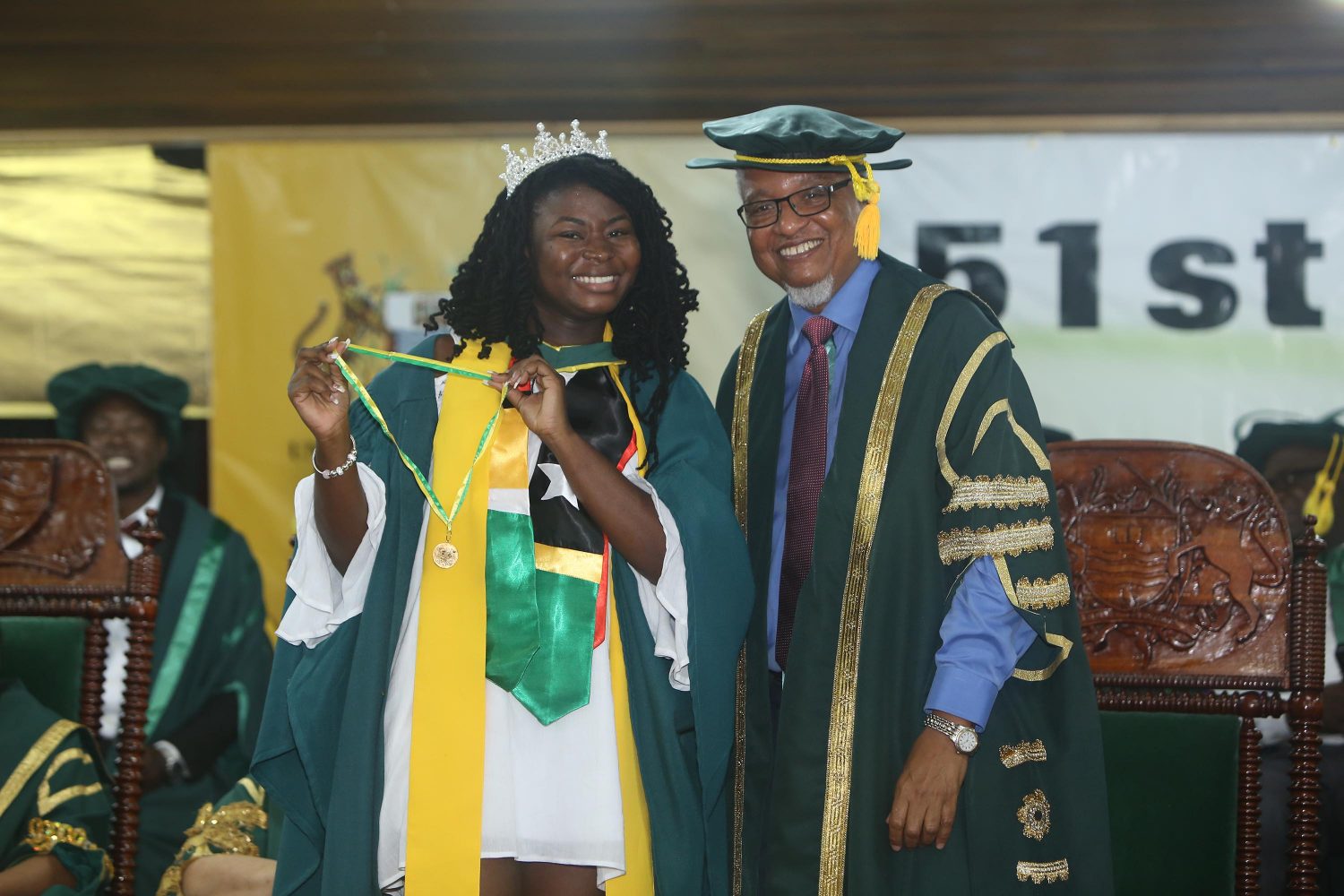 This year’s Best Graduating Student of the University of Guyana Elsie Harry posing with Chancellor Nigel Harris after being conferred with the President’s Award last evening at the institution’s 51st Convocation. Harry, who completed a Bachelors of Social Science Degree in International Relations with a perfect 4.0 Grade Point Average, was also conferred with three other awards.  (Photo by Keno George) 
