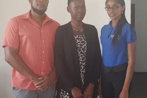 CEO and Co-founder of EPIC-Guyana Brian Backer, EPIC Scholarship recipient Candacey Glen and EPIC-Guyana Programme Coordinator Surujdai Mukhram at EPIC-Guyana’s 87 C Barrack Street, Kingston office on Friday (Mariah Lall photo) 