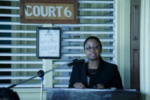 Chief Justice (acting) Roxane George addressing the gathering at the launching of the court. (Ministry of Social Protection photo)