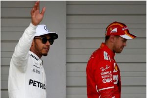 Japanese Grand Prix, Suzuka Circuit, Japan, October 7, 2017. Mercedes’ Lewis Hamilton celebrates pole position in qualifying next to Ferrari’s Sebastian Vettel (REUTERS/Toru Hanai) 