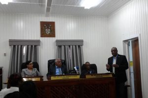 Minister of State Joseph Harmon speaking during the dedication ceremony for the Public Service Appellate Tribunal on Friday. Seated from left to right are tribunal member Abiola Wong-Inniss, Justice (Rtd) Nandram Kissoon and Winston Browne 