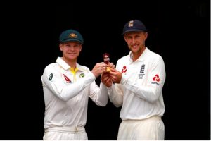 Australia’s cricket team captain Steve Smith holds a replica of the Ashes urn with England’s team captain Joe Root during an official event ahead of the Ashes opening test match at the GABBA ground in Brisbane, Australia, yesterday. REUTERS/David Gray