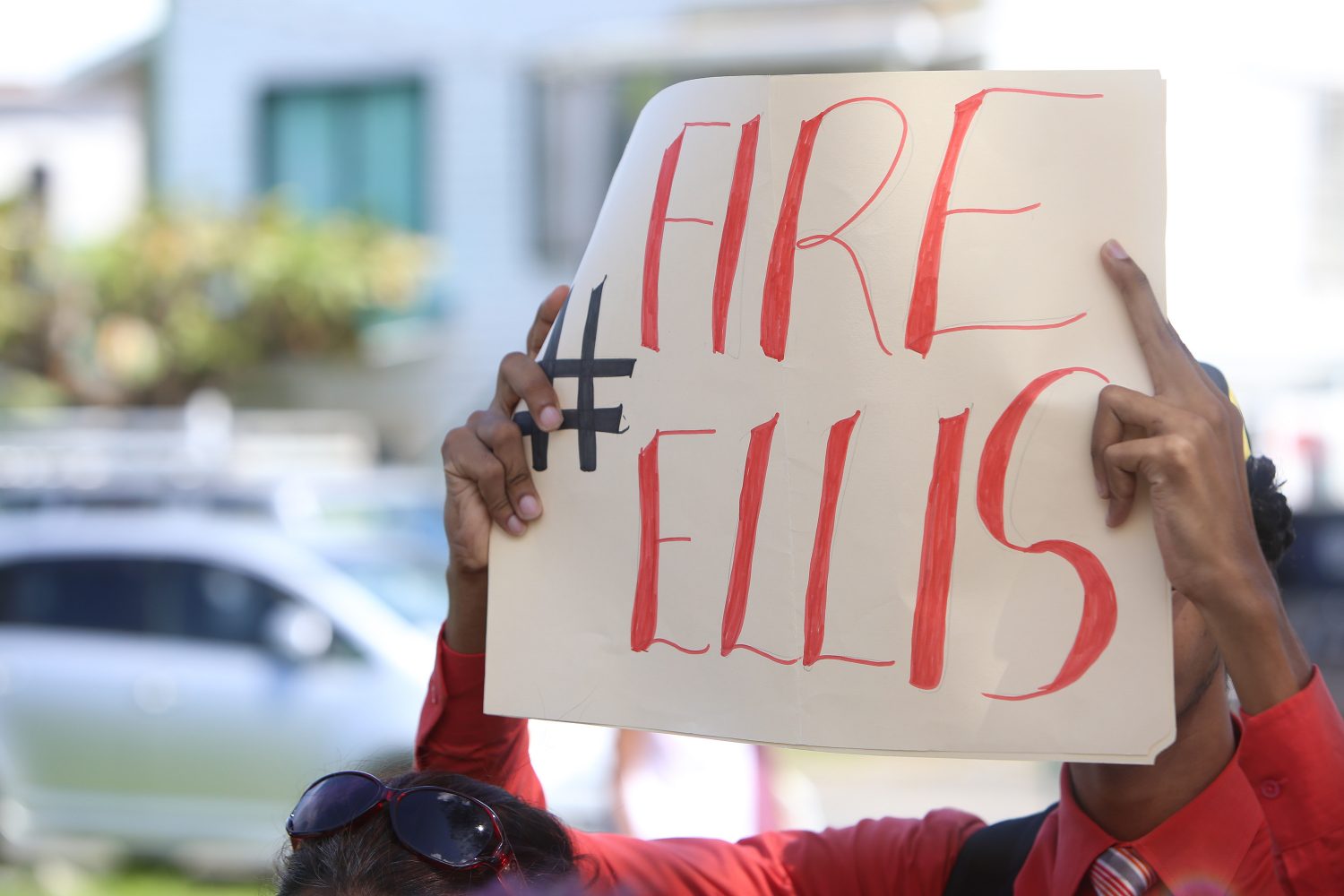 A protestor calling for the firing of Bishops’ High’s head teacher Winifred Ellis.