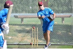 Head coach Stuart Law conducts throw-downs to batsman Shai Hope during a training session yesterday. (Photo courtesy CWI Media)