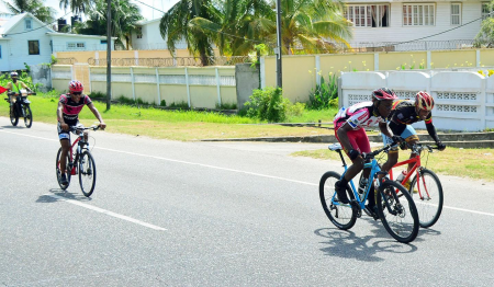 Jamal John of Team Coco’s powering across the line yesterday. The Team Coco’s standout stopped the clock in two hours, 14 minutes and 17 seconds for the 60-mile trek which started outside Ocean View Hotel, proceeded to Mahaicony and returned to the point of origin for the finish.