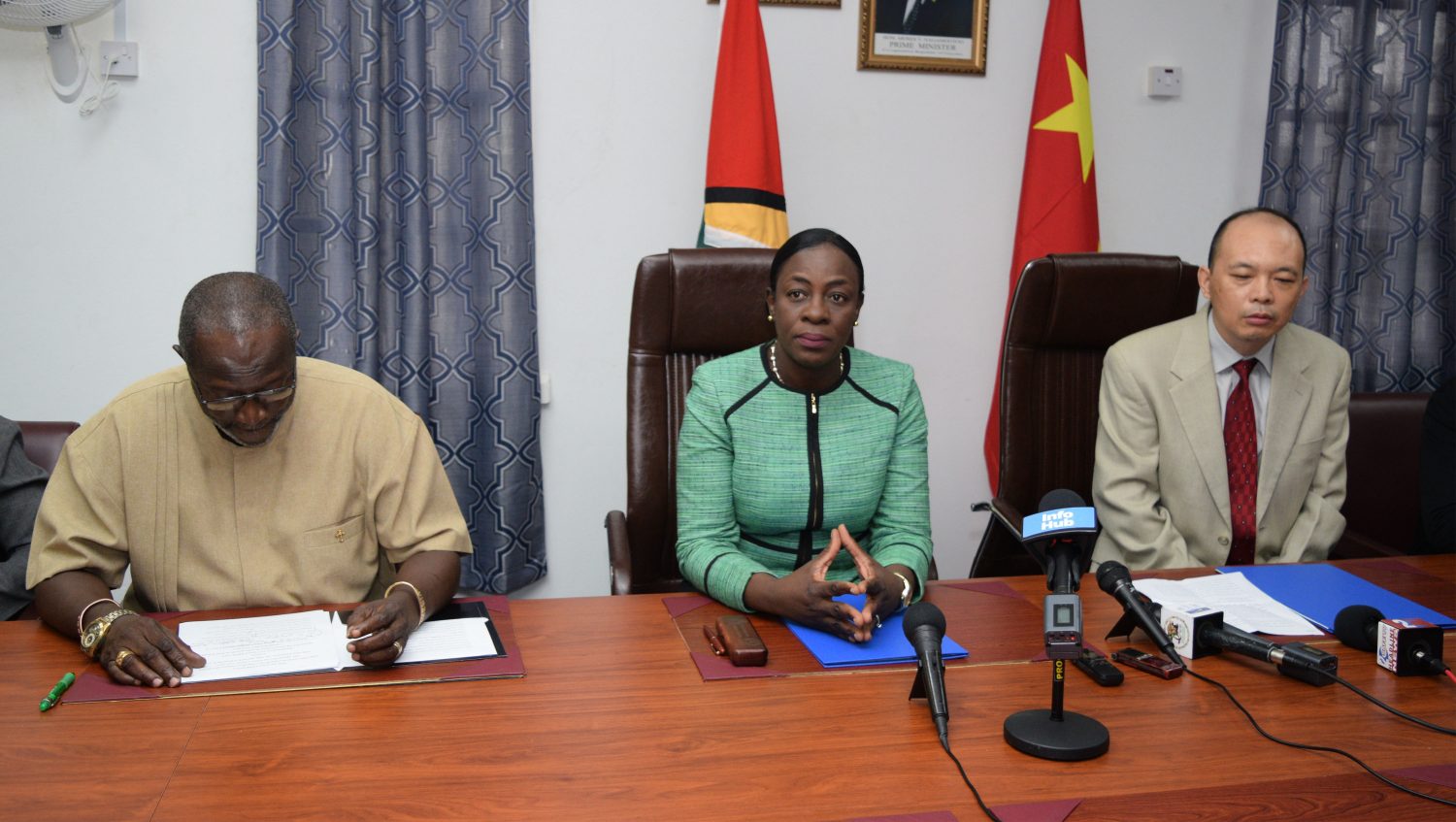 Minister of Education, Nicolette Henry (centre); Permanent Secretary, Vibert Welch (left) and Charge d’Affaires, Chinese Embassy, Chenqu Yang,  during the signing ceremony at the Ministry of Education Brickdam office.  (Department of Public Information photo)