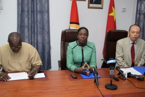Minister of Education, Nicolette Henry (centre); Permanent Secretary, Vibert Welch (left) and Charge d’Affaires, Chinese Embassy, Chenqu Yang,  during the signing ceremony at the Ministry of Education Brickdam office.  (Department of Public Information photo)