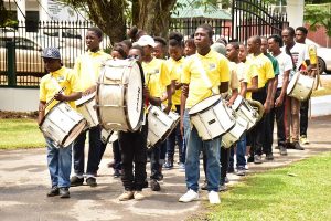The COFONA Band Corps marching into State House before the commencement of the Literacy Extravaganza.  (Ministry of the Presidency photo)