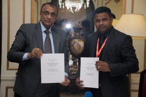 President of the Federation of Indian Export Organizations, Ganesh Kumar Gupta (left) and President of the Georgetown Chamber of Commerce and Industry,  Deodat Indar after the signing. (GCCI photo)