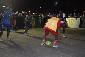 Action in the Channel-9-Warriors and Gaza Squad clash on the opening night of the Guinness ‘Greatest of the Streets’ Football Championship at the National Cultural Centre Tarmac Thursday night.