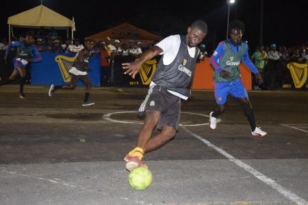  Flashback - Leon Fredericks (right) of Bent Street in pursuit of a Norton Street player during their clash at the National Cultural Center tarmac on the opening night of the  Guinness ‘Greatest of the Streets’ Georgetown Zone.