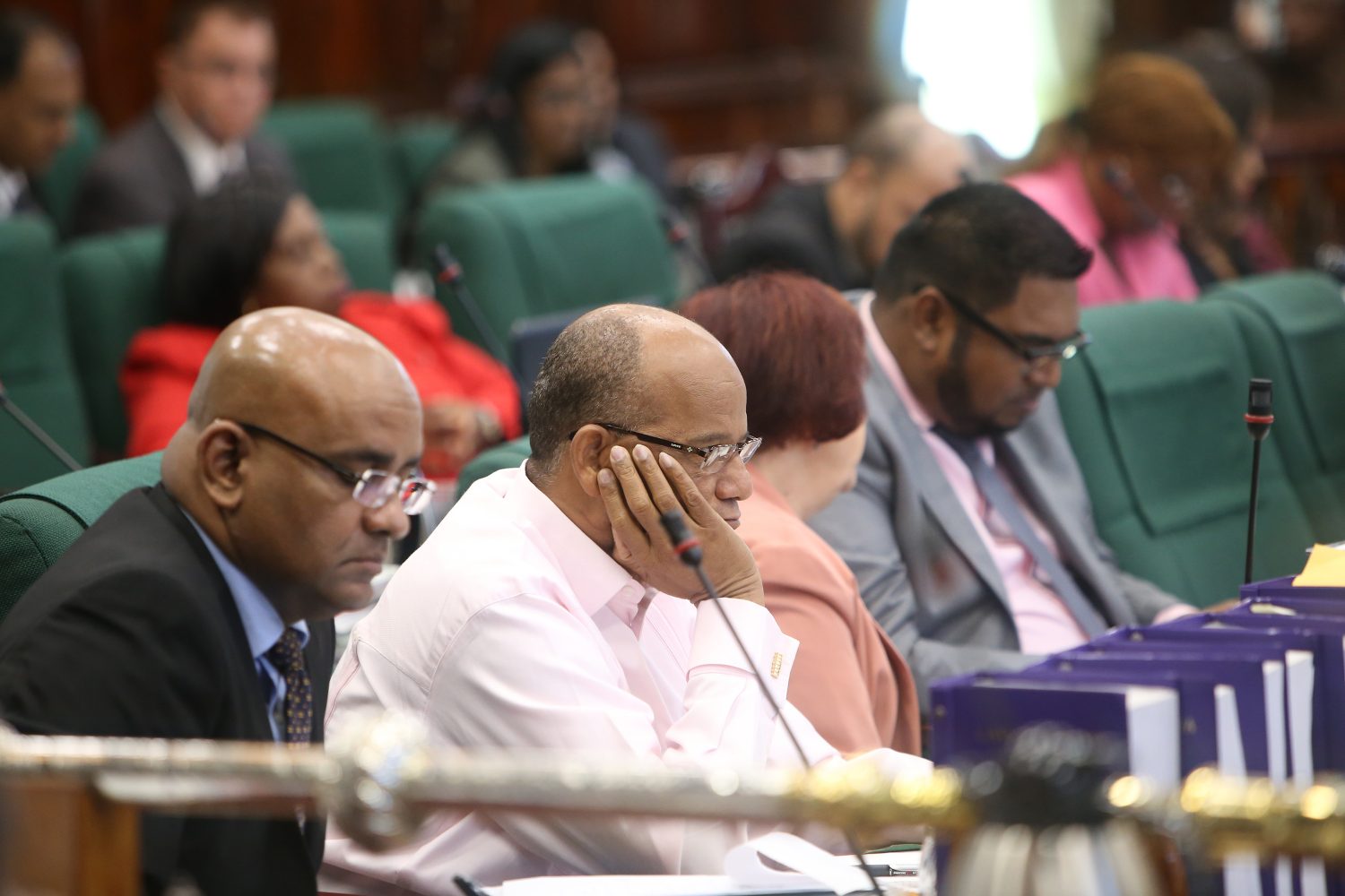 Opposition Leader Bharrat Jagdeo (left) and other PPP/C MPs listening to the budget presentation.