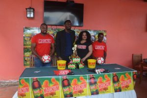NSC Director Christopher Jones (2nd from left) posing with members of the launch part for the Magnum Christmas Classic Futsal Championship at the Windjammer International Hotel & Cuisine. Also in the photo is tournament coordinator and Magnum representative Edison Jefford (left)