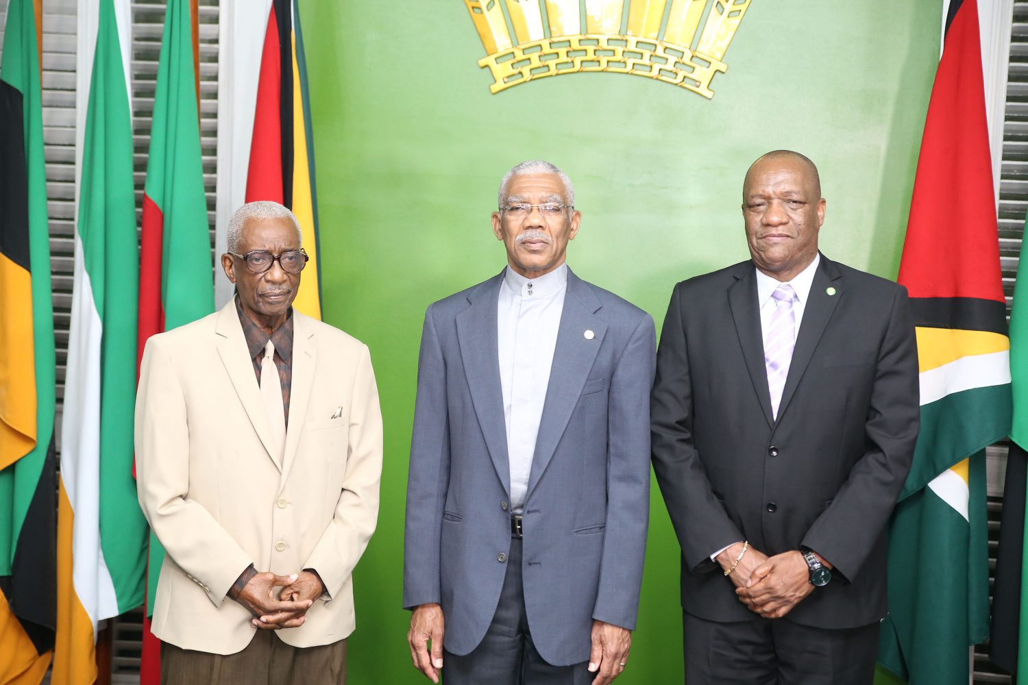 President David Granger (centre) with the new GECOM Chairman, retired Justice James Patterson (left) and Minister of State Joseph Harmon at the swearing in.