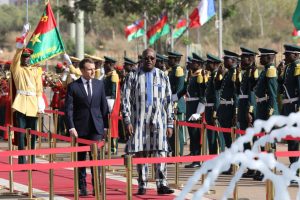French President Emmanuel Macron and Burkina Faso’s President Roch Marc Christian Kabore review an honour guard at the Presidential Palace in Ouagadougou, Burkina Faso, November 28, 2017. REUTERS/Ludovic Marin/Pool