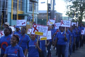 Members of one of the contingents that participated in an Awareness Walk and Interfaith Service, which was organised by the Ministry of Public Health yesterday in observance of World AIDS day, which is commemorated every year on December 1st. (Photo by Keno George)