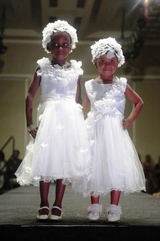 These little ladies are outfitted in pieces from Randy Madray’s Designs.
