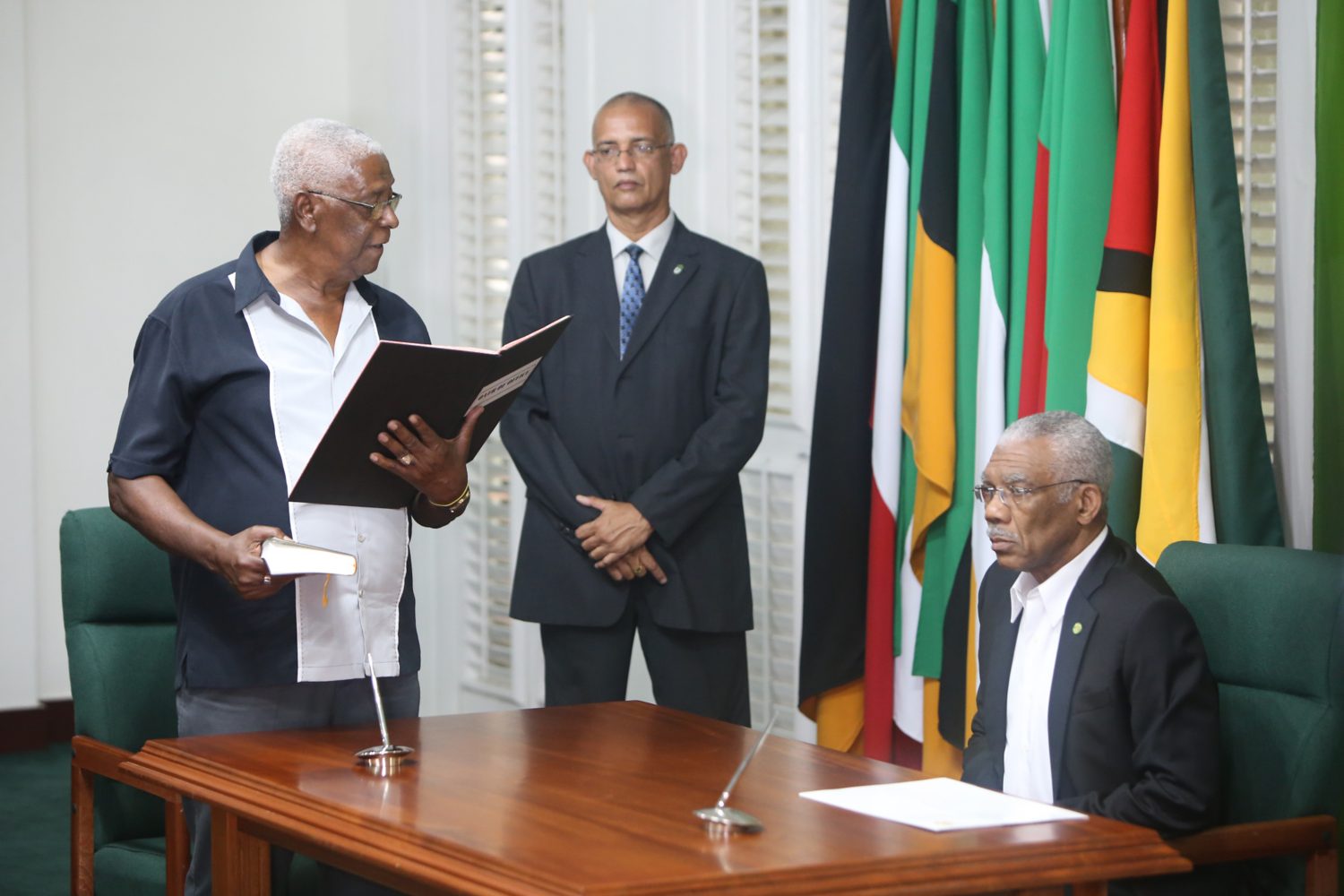 Desmond Trotman taking the oath of office as the newest member of the Guyana Elections Commission before President David Granger at State House yesterday (Photo by Keno George) 