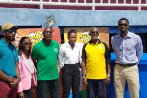 Aliann Pompey (centre) poses with the stakeholders of the Green Generation Guyana (3G) initiative on Friday at the National Track and Field Centre at Leonora.
