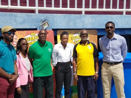 Aliann Pompey (centre) poses with the stakeholders of the Green Generation Guyana (3G) initiative on Friday at the National Track and Field Centre at Leonora.
