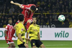 Bayern Munich’s Polish star Robert Lewandowski rises for a header.