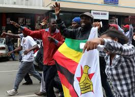 Protesters gather calling for Zimbabwean President Robert Mugabe to step down, in Harare, Zimbabwe yesterday. (REUTERS/Philimon Bulawayo)