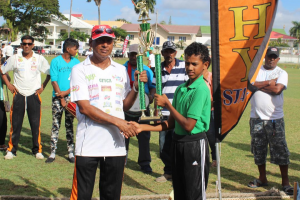 Flashback: The winning captain of Blairmont Blazers, Zinul Ramsammy receives the championship trophy from GFSCA Vice-President, Ramesh Sunich.