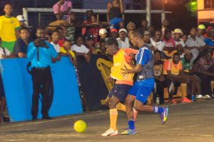 Flashback- Omallo Williams (left) of Leopold Street, trying to acquire possession of the ball, while being pursued by Gregory Richardson of Sparta Boss, during their semi-final clash at the Burnham Court, in the Guinness ‘Greatest of the Streets’ Georgetown Championship.