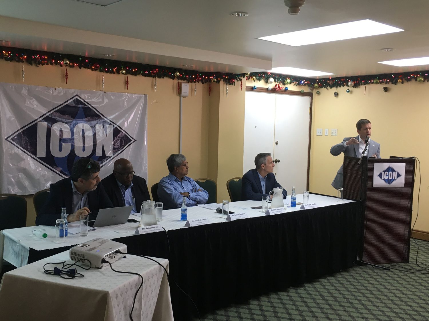 Seated from left: Icon’s Vice President Nelson Garcez, Icon Chairman, Stephen Scoon, DDL Chairman Komal Samaroo, Icon Chief Technical Officer, Hugo Armella, along with Icon President John Thompson (at the podium), during Icon’s official launch yesterday at Cara Lodge.