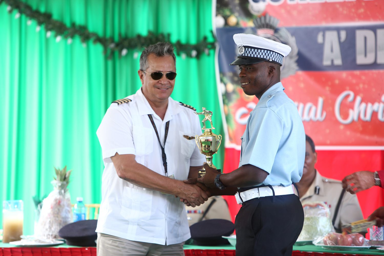 Sergeant 19499 Garvin Boyce (right) who was awarded ‘A’ Division Best Cop, collecting a trophy from Chief Executive Officer (CEO) of Roraima Airways Captain Gerry Gouveia.
