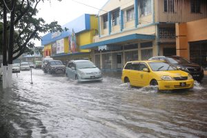Main St flood: Yesterday’s heavy rain flooded Main Street temporarily.