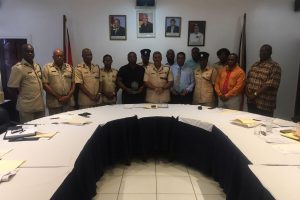 Commissioner of Police David Ramnarine (ag) (sixth from left) flanked by the ranks who graduated from University of Guyana. Also in this photo are Crime Chief (ag) Paul Williams (second from right&25) and other senior police officials including the Divisional commanders.
