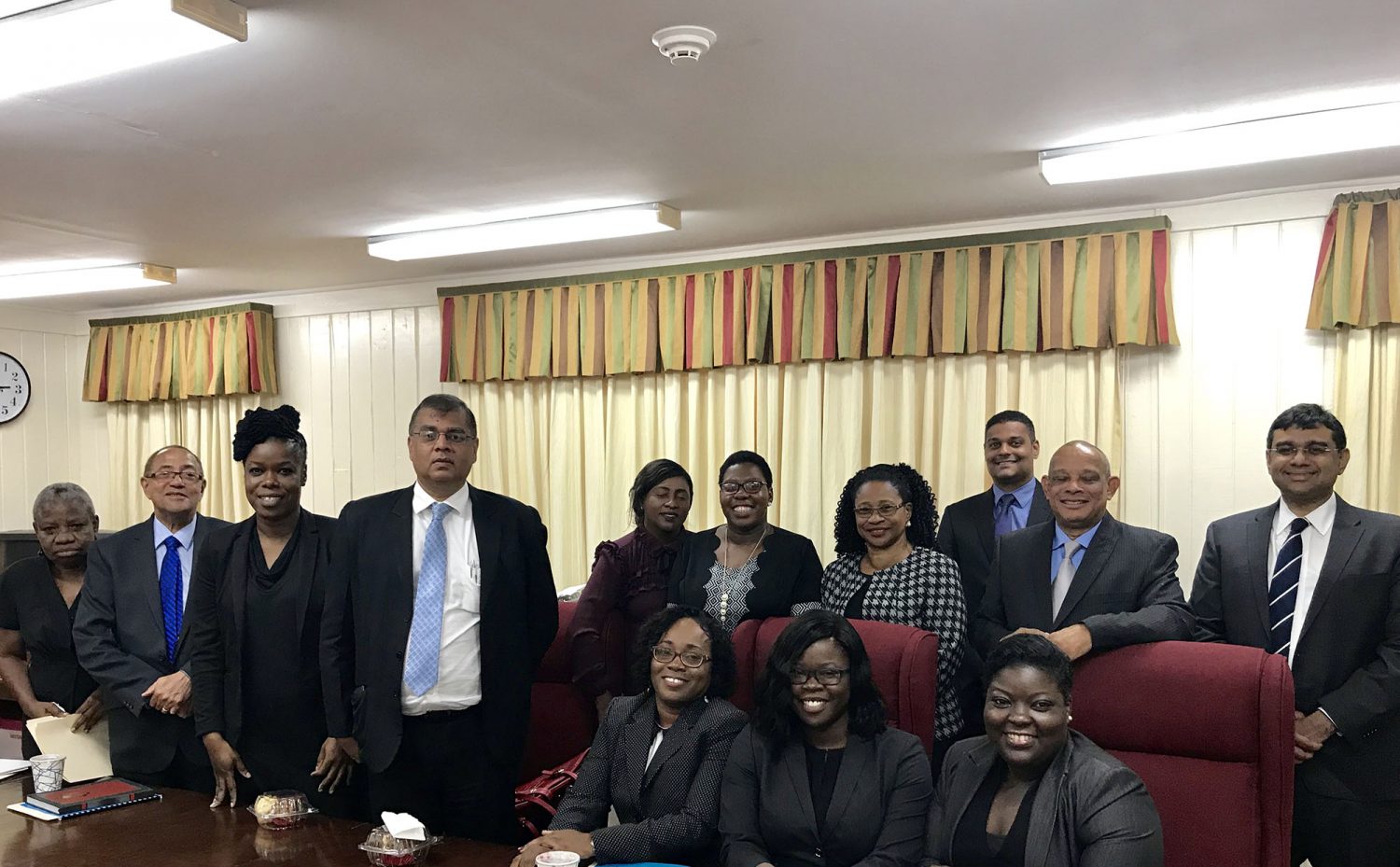 From left to right (standing) are Emily Dodson, Robin Stoby, Dionne Mc Cammon,  Narendra Singh,  Kim Kyte-Thomas, Ayana Mc Calman (representative of the Attorney General), Justice Yonette Cummings-Edwards, Kamal Ramkarran, Andrew Pollard and Devindra Kissoon. From left to right (sitting) are  Tracy Gibson,  Faye Barker-Meredith and Mandisa Breedy. 
