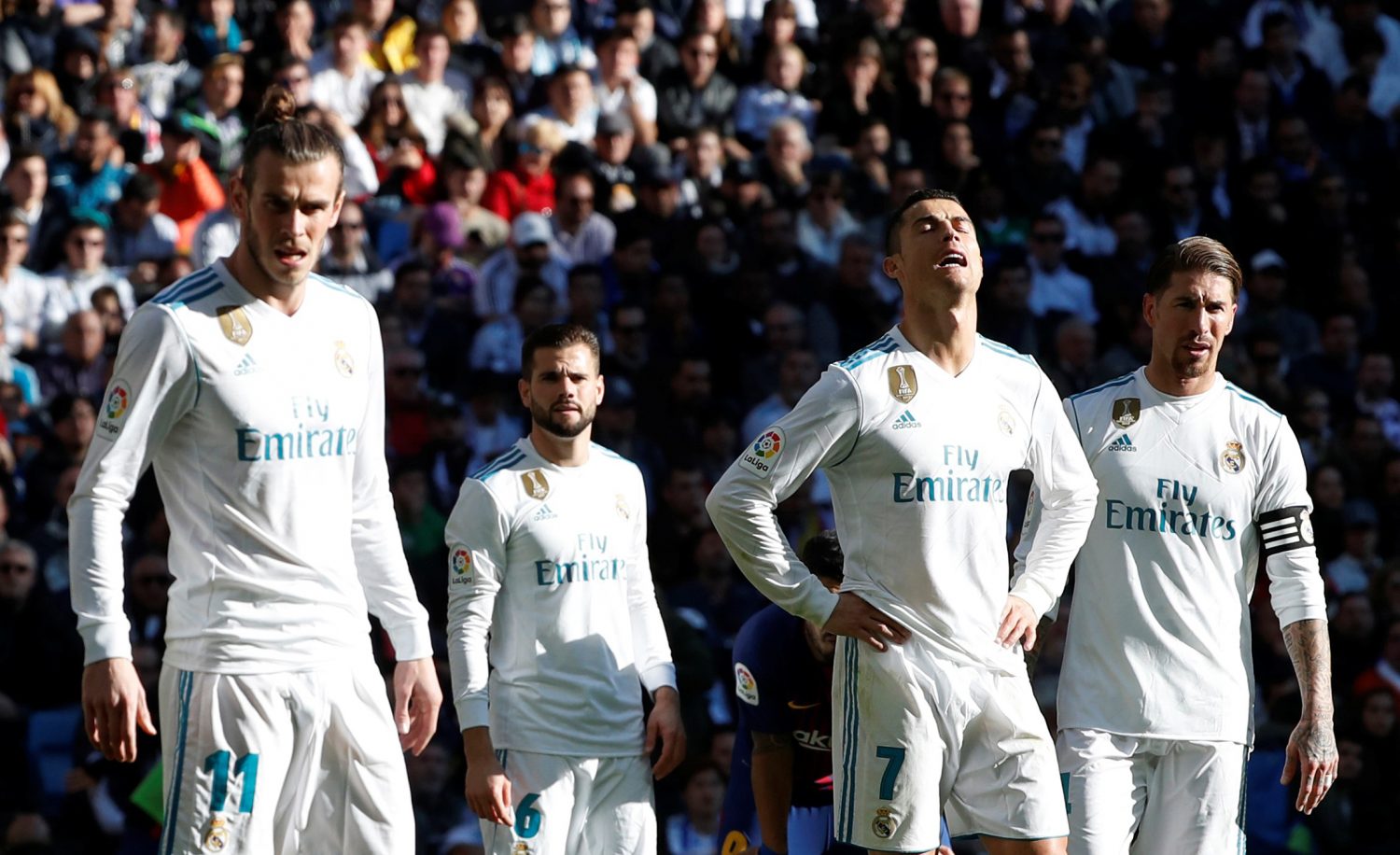 Real Madrid’s Gareth Bale, Cristiano Ronaldo and Sergio Ramos react REUTERS/Paul Hanna