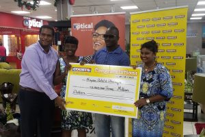 Courts million-dollar winners: From right are Petal Surujpaul, Olwin Lynch, Nayaa Rose and a Courts representative