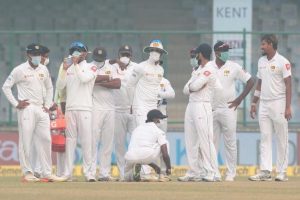 Sri Lanka players, wearing face masks, celebrate the dismissal of India’s Ajinkya Rahane. REUTERS/Stringer