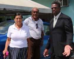 Ingrid Durity, with husband Christopher Samuel, and attorney Jerry Holder, right, outside the Sangre Grande Magistrate’s Court on Friday.
