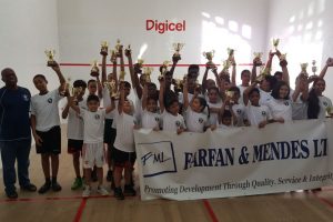 The respective champions and top four finishers in each division, pose with their spoils following the conclusion of the Farfan and Mendes Junior Skill Level Squash Championship 