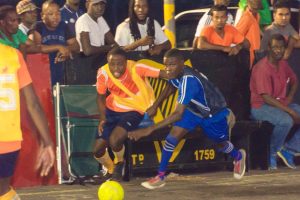 Flashback-Tyrese Forde (left) of Leopold Street and Eusi Phillips of Sparta Boss tussling during their semi-final clash at the Burnham Court, in the Guinness ‘Greatest of the Streets’ Georgetown Zone competition.
