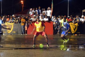 Cornered- Sheldon Shepherd (left), Eusi Philips (2nd right) and Gregory Richardson (right) of Sparta Boss, surrounding a Channel-9 Warriors player, during their clash at the National Cultural Centre, in the Guinness СGreatest of the StreetsТ Georgetown Zone
