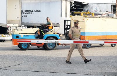 Business as usual… Operations resumed following a million dollar heist at Cargo bond area of Piarco International Airport, yesterday.