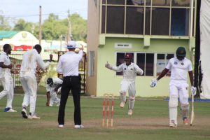 Given! Anthony Bramble is adjudged LBW by umpire Christopher Taylor as the Islanders celebrate a moral victory (Royston Alkins Photo)