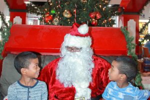 These two boys are in all smiles in anticipation of their gifts from Santa at Giftland Mall   (Photo by Arian Browne)