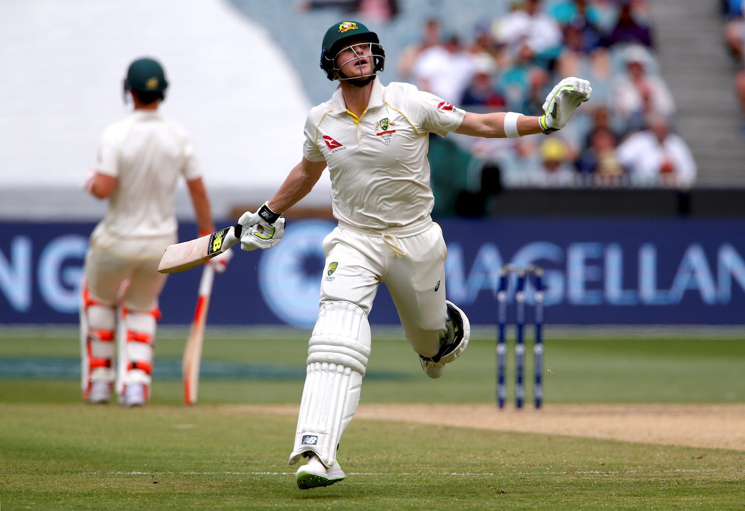 Australia’s captain Steve Smith reacts after he was hit by the ball running between wickets during the fifth day of the fourth Ashes cricket test match. REUTERS/David Gray