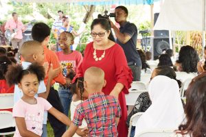 Two hundred feted at Mrs. Nagamootoo’s party for children. The Lawns of the Prime Minister’s Residence came alive on Saturday afternoon as Sita Nagamootoo (centre), wife of Prime Minister Moses Nagamootoo and their family hosted a Christmas Party for more than 200 children. (DPI photo) 