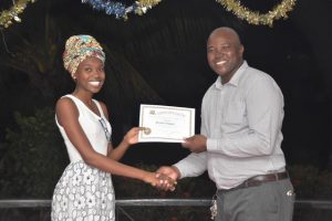 Enmore Estate Manager, Curbette Victorine (right) presenting a certificate (DPI photo)