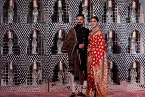 India’s cricket team captain Virat Kohli (L) and his wife, Bollywood actress Anushka Sharma, pose during a photo opportunity at their wedding reception in New Delhi, India December 21, 2017. REUTERS/ Adnan Abidi TPX IMAGES OF THE DAY