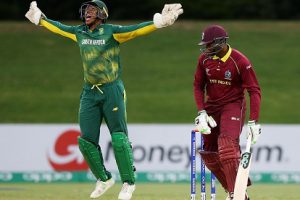 West Indies batsman Bhaskar Yadram falls to a catch at the wicket as Wandile Makwetu celebrates. (Photo courtesy ICC Media) 