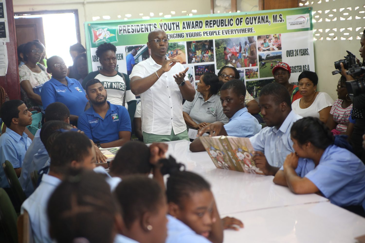 Executive Officer of the President’s Youth Award Programme Dr Allister Collins speaking to students and parents at the Open Doors Centre about the youth programme yesterday (Keno George photo)